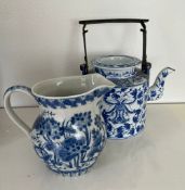 Oriental blue and white china, one jug and a metal handled teapot.