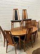 A Danish Mid Century two leaf dining table and eight chairs by Koefoed