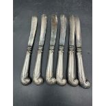 A set of six silver handled, hallmarked for Sheffield 1906 by Harrison Brothers & Howson