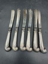 A set of six silver handled, hallmarked for Sheffield 1906 by Harrison Brothers & Howson
