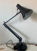 A black angle poise lamp