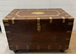 A camphor wood brass banded campaign chest with two inner candle boxes