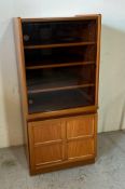 A Parker Knoll Nathan glazed record cabinet (H112cm W51cm D44cm)