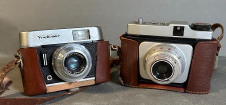 Two vintage cameras, a Voigtlander and a Cecto-phot, both cased