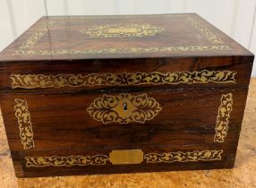 A Ladies vanity box with decorative brass inlay, fitted interior, three original perfume bottles,