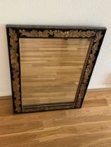 An ornate framed mirror, hardwood (56cm x 73cm)