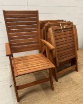 A set of six teak slated folding garden chairs