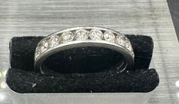 A platinum ring set with ten diamonds Size J