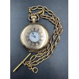 A gold plated half hunter pocket watch on a 9ct gold Albert chain (Approximate weight of chain 38.