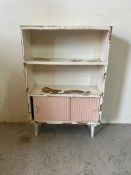 A Mid Century white painted bookcase with two door sliding cupboard under AF (H92cm W61cm D23cm)