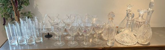 A large selection of glasses including cocktail glasses and beer glasses etc