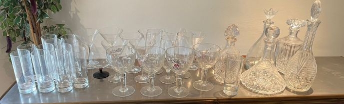 A large selection of glasses including cocktail glasses and beer glasses etc