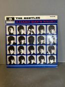 A vinyl copy of The Beatles "A Hard Days Night" ref XEX481