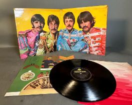 A First pressing of The Beatles "S Pepper" with inserts
