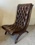 A Regency style brown leather button back salon chair (H101cm W59cm D67cm)