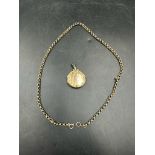 A 9ct gold necklace (Approximate weight 6.5g) with a 9ct gold front and back locket (Approximate