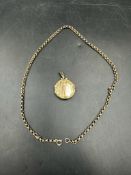 A 9ct gold necklace (Approximate weight 6.5g) with a 9ct gold front and back locket (Approximate