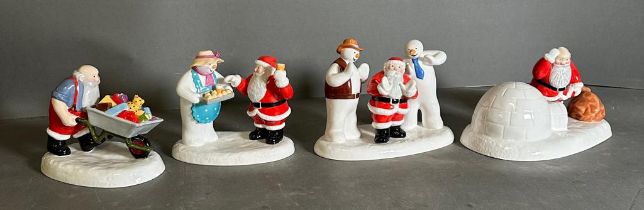 Four Coalport "Raymond Brigg" father christmas figures to include "Almost There", "All Hime