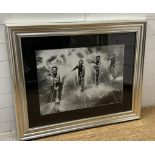 A framed black and white photograph of a 1950's water skiing party 69x49