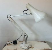 A vintage white angle poise lighting desk lamp