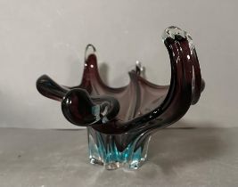 A crystal encased aubergine and turquoise glass centrepiece.