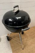 A Weber kettle charcoal BBQ
