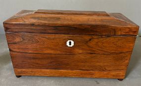 A Rosewood sarcophagus shaped tea caddy with loop handles (32cm x 16cm x 16cm)