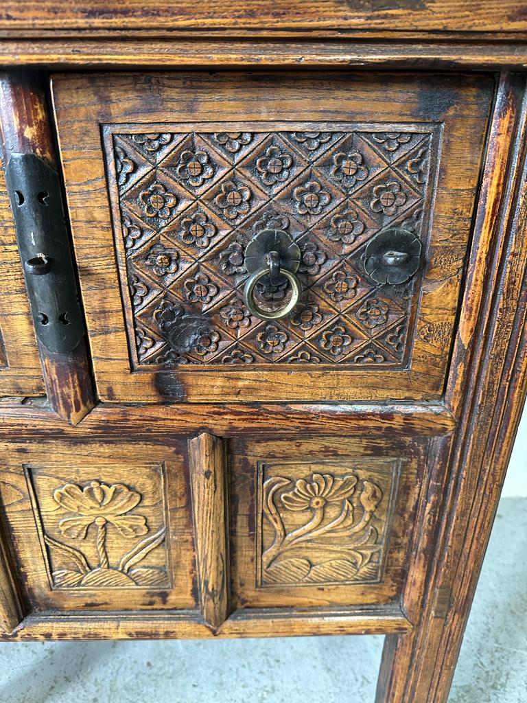 A vintage Burmese two drawer wine table with carved floral detail (H85cm W108cm D55cm) - Image 3 of 4
