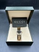 A GUCCI ladies watch in box with papers