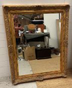 A wooden gold painted hall mirror 99cm x 127cm