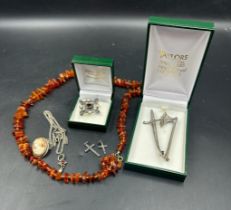 A small selection of costume jewellery including some silver items.