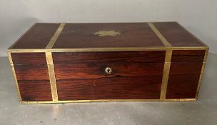 An Early 19th Century rosewood and brass bound campaign desk/writing slope with filly fitted