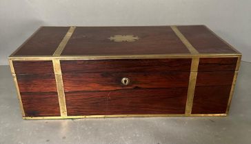 An Early 19th Century rosewood and brass bound campaign desk/writing slope with filly fitted