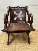 An oak carved Glastonbury chair