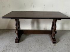 An oak Arts and Craft style coffee table (H46cm W90cm D47cm)