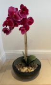 A faux Orchid plant