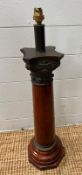 A single column wooden lamp base, with bronze top Height 68cm