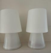 A pair of white plastic mushroom table lamps, battery operated