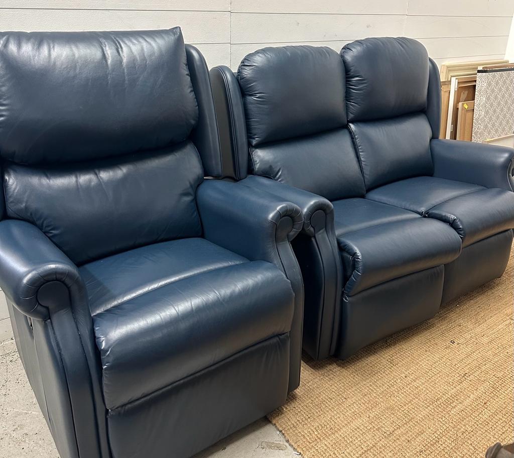A blue leather two seater sofa with matching reclining arm chair (Sofa H115cm D90cm W140cm)