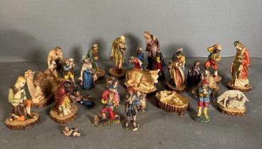 A Nativity set, one set is Italian with additional items from a further set.