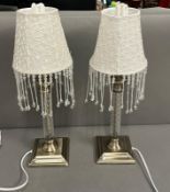 A pair of contemporary lamps with beaded lampshades