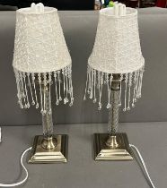 A pair of contemporary lamps with beaded lampshades