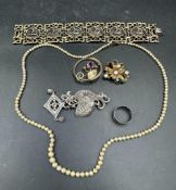 A selection of costume jewellery, various styles and finishes including some silver.