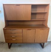 A Mid Century four drawer and two cupboard Highboy by Europa (H 140cm W127cm D50cm)