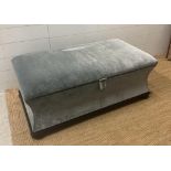 A contemporary ottoman upholstered in grey velour (H43cm D55cm W106cm)
