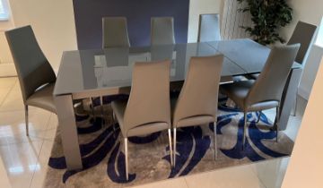 A Calligaris extending dining room table and eight chairs (Extended H75cm W220cm D90cm)