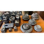 A sizeable collection of cast iron scale weights, various makers and weights.