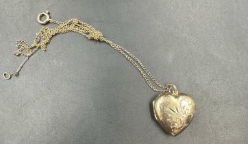 A 9ct gold locket on chain, locket total weight 2.3g