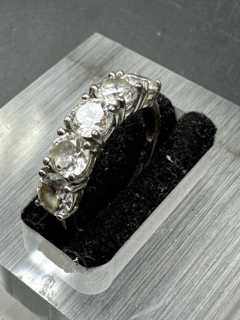 A silver ring marked 925 with five clear glass stones size O - Image 3 of 4