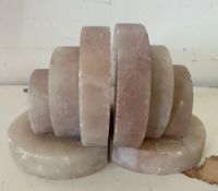 A pair of two pink marble Art Deco book ends (H10cm W9cm)